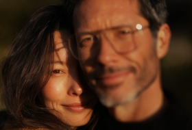 couples smiling and looking on camera